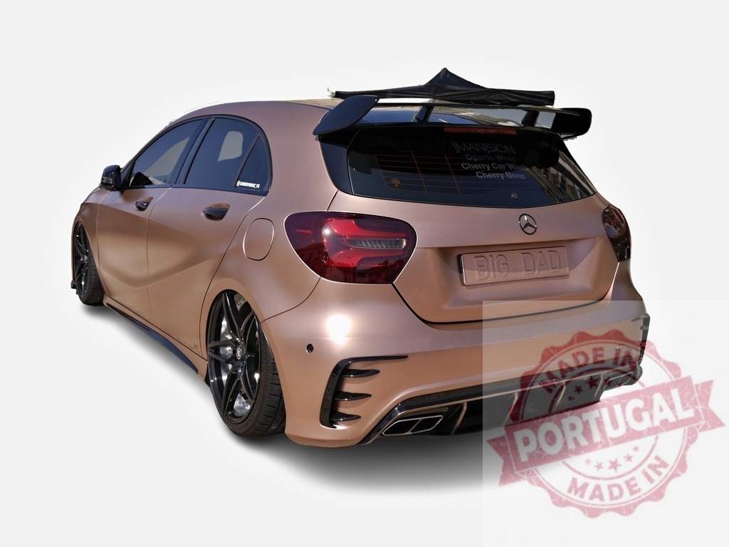 Tuned Mercedes-Benz A45 AMG showing its rear and spoiler | Modern tuned hatchback Mercedes parked and showing its custom metallic pink wrap, big spoiler and diffuser - Realized with Pictrs.com
