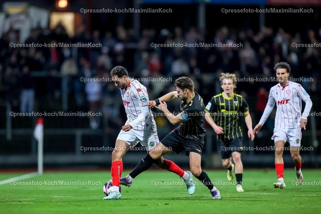 FKo26022601011 | 26.02.2026, Fußball, Landespokal Mittelrhein, SC Fortuna Köln - TSV Alemannia Aachen, Südstadion, Viertelfinale Bitburger-Pokal, Saison 2025 2026: Hamadi Al-Ghaddioui&nbsp; (SC Fortuna Köln #18) im Zweikampf gegen  Sasa Strujic&nbsp; (Alemannia Aachen #05)  DFB regulations prohibit any use of photographs as image sequences and or quasi-video.