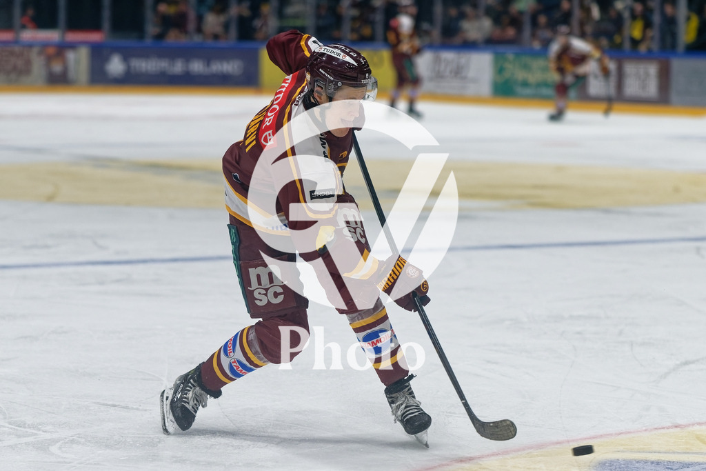 National League - Geneve-Servette HC v EV Zug | Jesse Puljujarvi (9 Geneve-Servette HC) shoots the puck (action)  during the National League match between Geneve-Servette HC and EV Zug at Les Vernets in Geneva, Switzerland