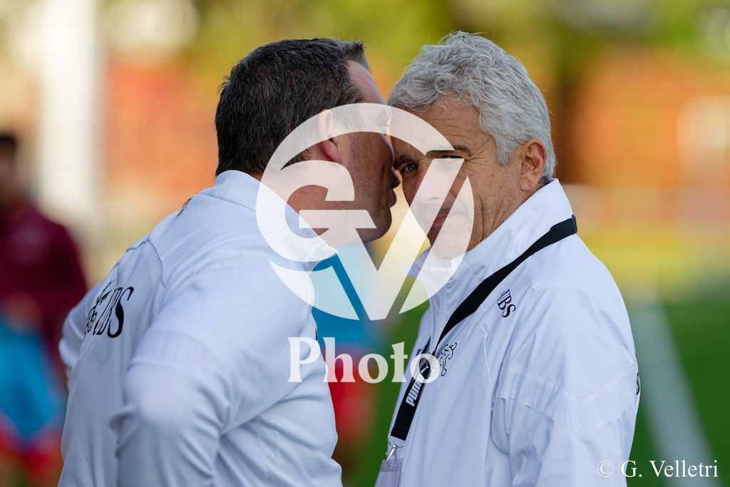 UEFA Region's Cup - Vaud v Munster | Aymon Jean-Yves (Coach Vaud) speaks with assistant coach during the UEFA Region's Cup game between Vaud and Munster at Centre Sportif de Colovray in Nyon, Switzerland 