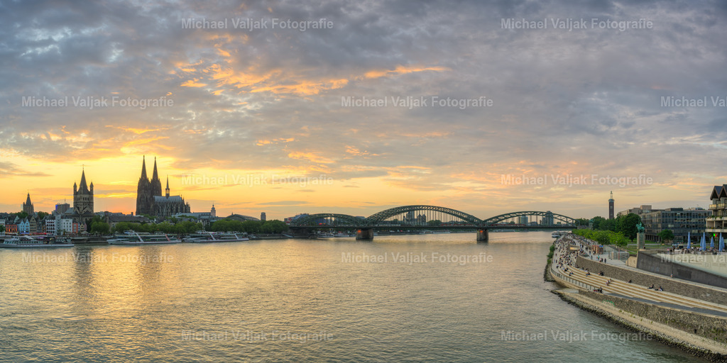 Köln Panorama | Das Kölner Panorama am Abend bietet einen atemberaubenden Anblick, besonders wenn man es von der Deutzer Brücke aus betrachtet. Die Silhouette der Stadt mit dem imposanten Kölner Dom und der Hohenzollernbrücke, die sich vor dem malerischen Sonnenuntergang abzeichnet, ist ein beliebtes Motiv für Fotografen und Besucher. - Realisiert mit Pictrs.com