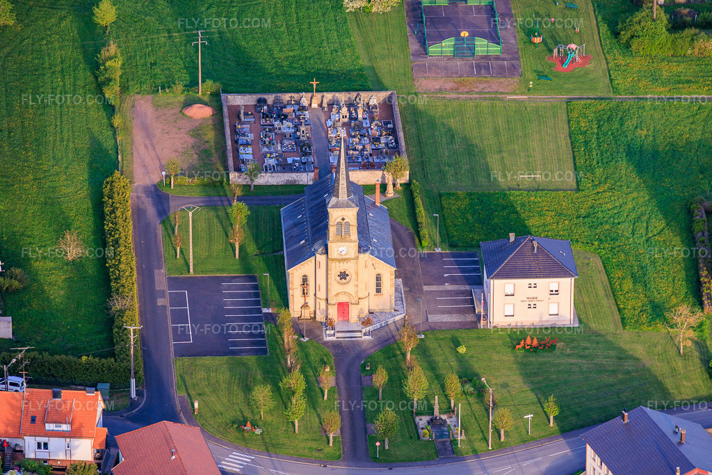 Aerial view: Church of Saint Joseph of the West in Frémestroff in the state Moselle, France.Photo: IMG_154769.jpg taken on 04/17/2026 by Werner Riehm/FLY-FOTO.comResolution of the original: 5846 x 3898 px