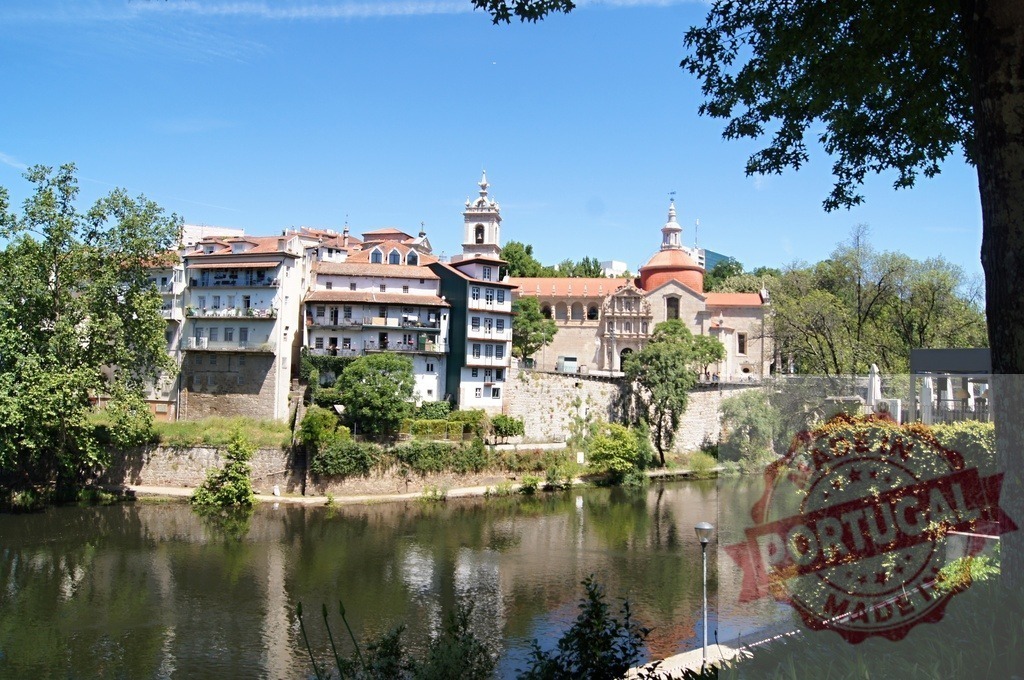 Amarante cityscape and Tâmega River reflecting buildings | Amarante town buildings and Monastery of Saint Gonçalo reflecting in the Tâmega river on a sunny day - Realized with Pictrs.com