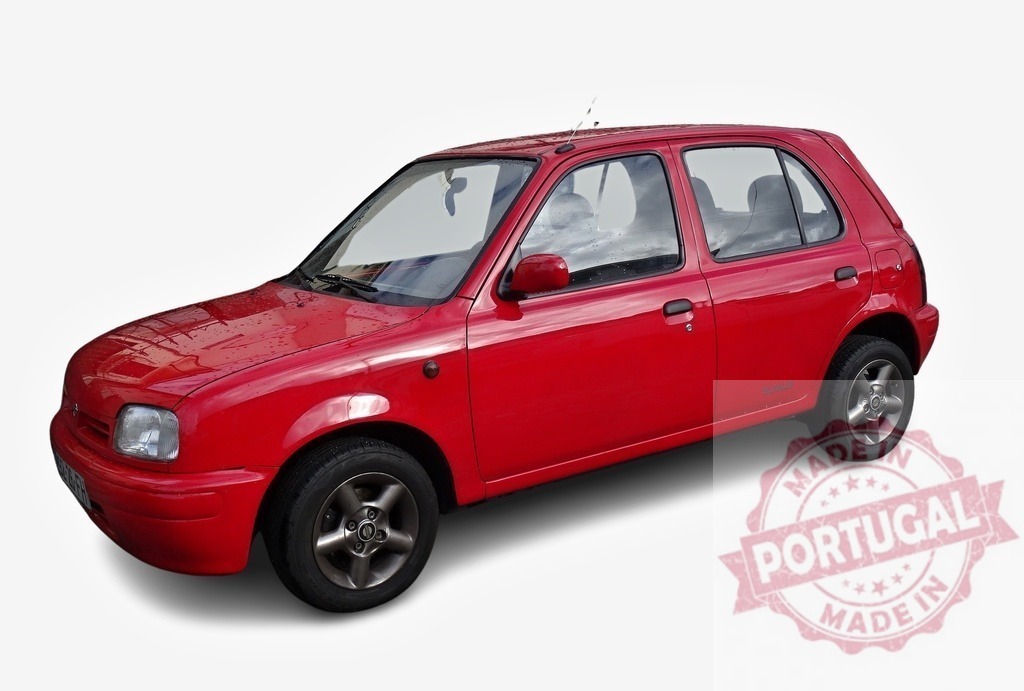 Red Nissan Micra Super S on a white background | Small city car Nissan Micra Super S, red, on a white background - Realized with Pictrs.com