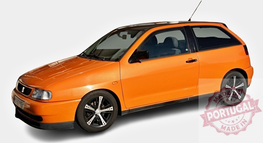Orange SEAT Ibiza showing its left side, parked on a white background | Small orange SEAT Ibiza parked, showing its left side, with black tinted rear windows and alloy wheels - Realized with Pictrs.com