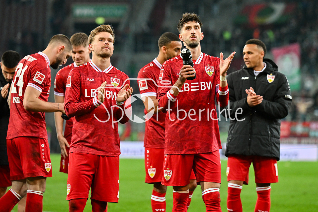 FC Augsburg - VfB Stuttgart | AUGSBURG, GERMANY - 22. MAERZ: die Spieler der Gäste feiern zusammen mit den Fans den Auswärtssieg in Sutttgart nach dem Bundesligamatch zwischen dem FC Augsburg und dem VfB Stuttgart am 27. Spieltag in der WWK Arena / DFL REGULATIONS PROHIBIT ANY USE OF PHOTOGRAPHS AS IMAGE SEQUENCES AND/OR QUASI-VIDEO / Maximilian MITTELSTÄDT (VfB Stuttgart 7), ATAKAN KARAZOR (VFB STUTTGART 16)