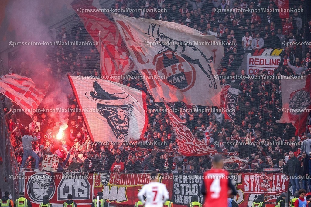 DFB05022502209 | 05.02.2025, Fußball, DFB-Pokal Viertelfinale, Bayer 04 Leverkusen - 1.FC Köln, BayArena, Saison 2024 2025: Pyrotechnik und Flaggen im Gästeblock der Kölner FansDFB regulations prohibit any use of photographs as image sequences and or quasi-video.