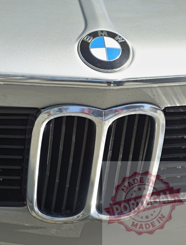 BMW luxury car chrome grille and historic logo | BMW logo and front grille details of an classic luxury automobile - Realized with Pictrs.com