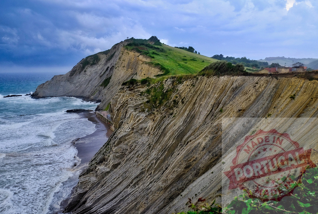 Zumaia Itzurun beach flysch formation cliff geology | Sedimentary rock layers forming a unique flysch coastline along the Atlantic Ocean - Realized with Pictrs.com