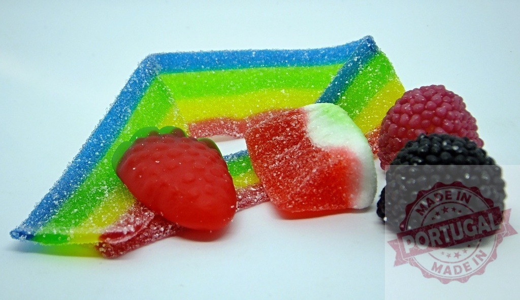 Colorful sugared gummy candies close up on white background | Collection of various fruit-shaped, sour, sugared and colorful gummy candies - Realized with Pictrs.com