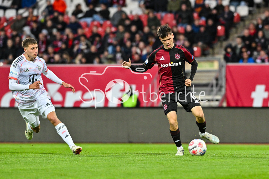 1. FC Nürnberg II - FC Bayern Amateure | NÜRNBERG, GERMANY - 21. APRIL: im Duell Robert Edward Jr. DEZIEL (FC Bayern München II 5) und Pascal FUCHS (1. FC Nürnberg II 6) während dem Match zwischen dem 1. FC Nürnberg II und den Amateuren des FC Bayern am 30. Spieltag der Regionalliga Bayern im Max-Morlock Stadion
