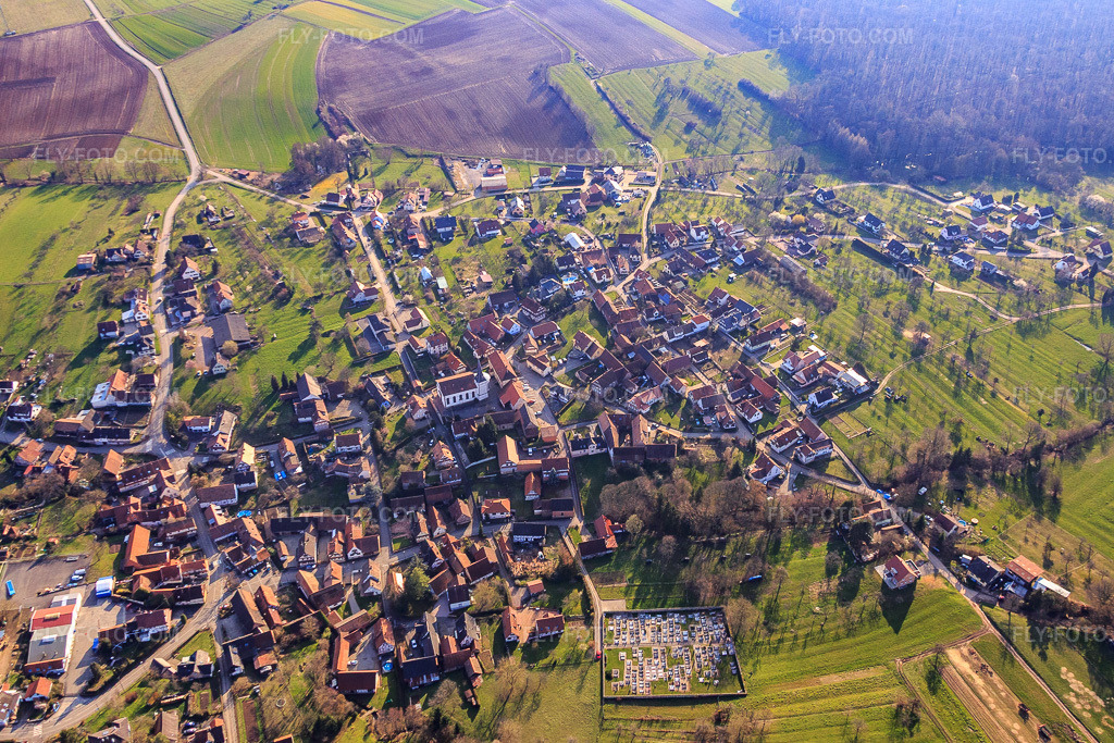 Aerial view: Village overview from the northeast in Lampertsloch in the state Bas-Rhin, France. – Photo: IMG_086669.jpg taken on 03/26/2016 by Werner Riehm/FLY-FOTO.com – Resolution of the original: 4833 x 3222 px
