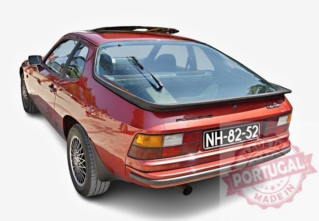 Red Porsche 924 classic sports car isolated on white | Red Porsche 924 vintage sports car showing its rear view on white background - Realisiert mit Pictrs.com
