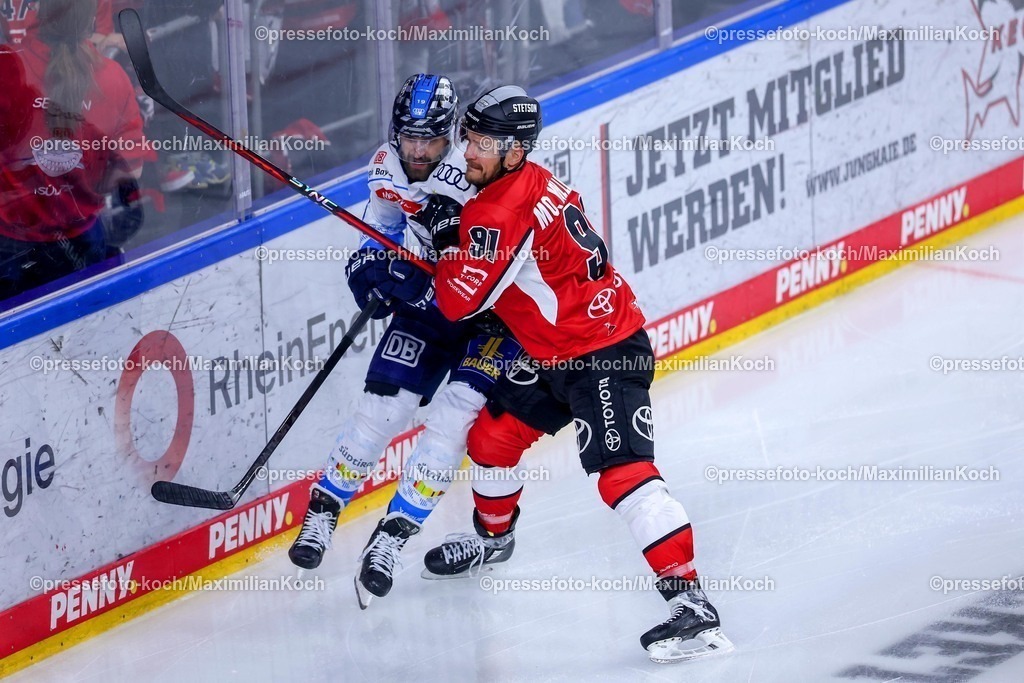 KEC1404251057 | 14.04.2025, Eishockey, DEL Play-offs, Kölner Haie - ERC Ingolstadt, Halbfinale Spiel 6, Lanxess-Arena KölnWojciech Stachowiak (ERC Ingolstadt #19) im Zweikampf gegen Moritz Müller (Kölner Haie #91) 