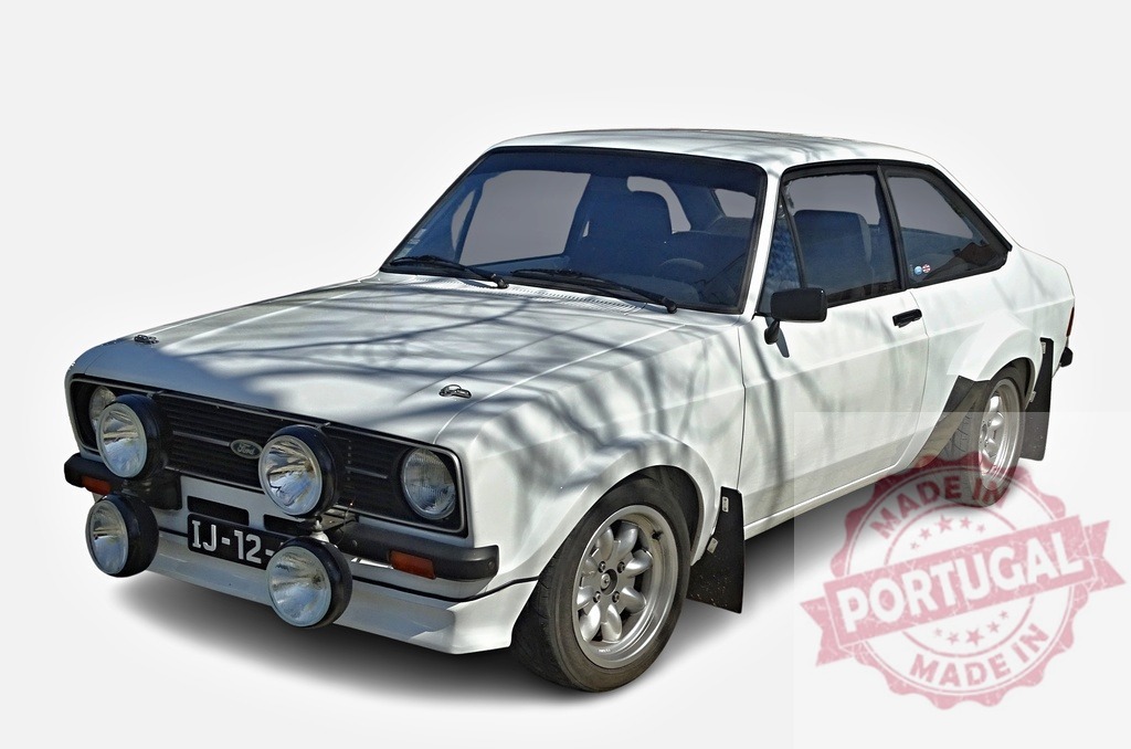 White Ford Escort RS2000 MKII parked with additional lights and mudflaps | Classic white Ford Escort RS2000 MKII rally car parked, featuring additional lights and mudflaps - Realized with Pictrs.com