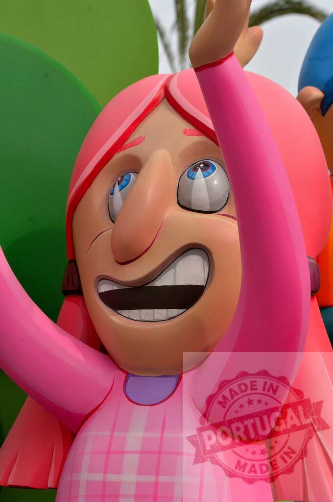 Colorful ninot falla celebrating Las Fallas festival in Valencia. Fallas Fiestas Communidad Valenciana | Pink-haired ninot sculpture with a big smile, representing the traditional Fallas festival - Realized with Pictrs.com