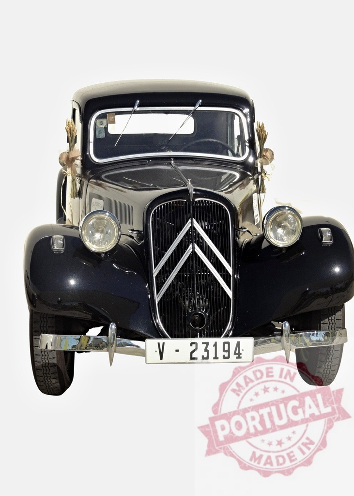 Black Citroën Traction Avant decorated with ears of wheat posing in front view | Classic black Citroën Traction Avant decorated with ears of wheat, a symbol of prosperity and good luck - Realized with Pictrs.com