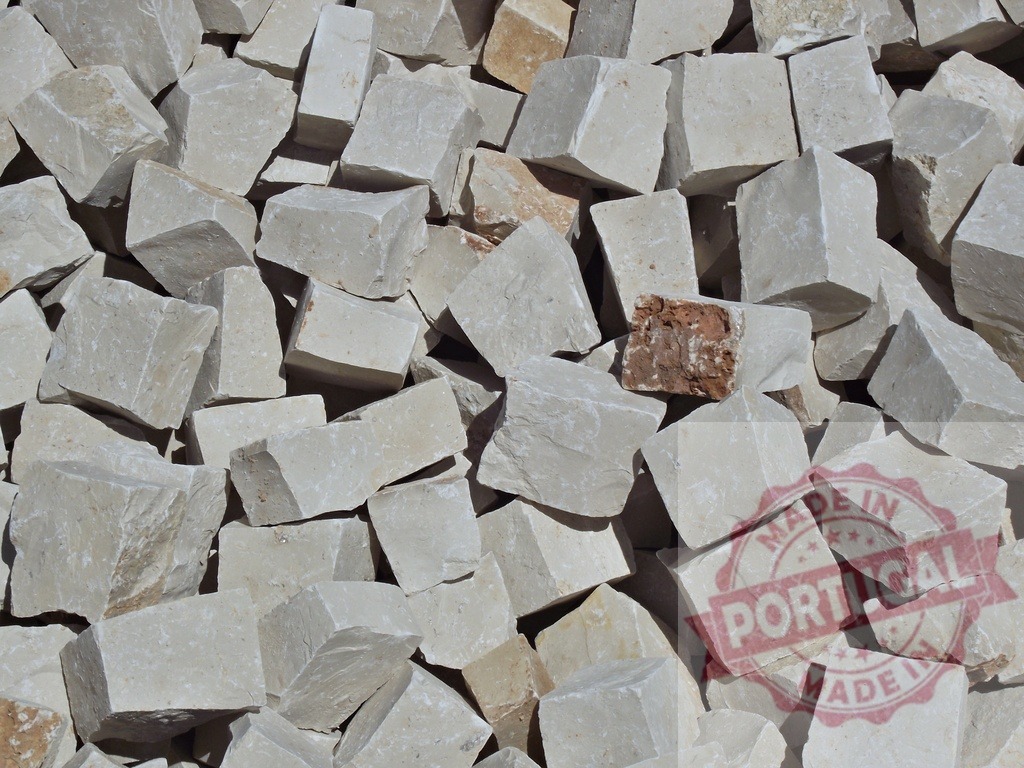 Pile of cut stone creating raw material background | Rough cut stone blocks forming an abstract pile of natural construction material - Realisiert mit Pictrs.com