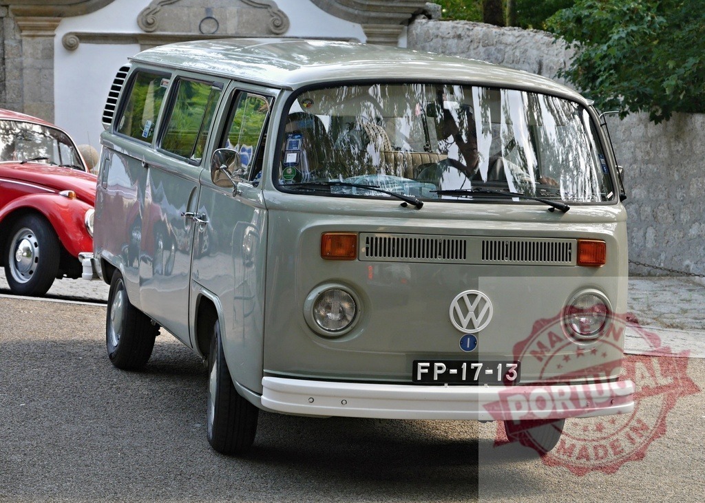 Volkswagen Type 2 van parked on street | Classic Volkswagen Type 2 van parked on a street with a red car in background - Realized with Pictrs.com