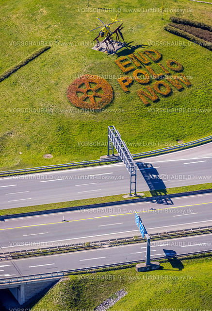 Kamen220403892Rotary | Luftbild, 20.000 Tulpen pflanzten die Kamener Rotarier am Kamener Kreuz unterhalb der ADAC-Hubschrauber-Skulptur. Sie werden in den nächsten Tagen blühen. 
Rotarys Kampf gegen die Kinderlähmung (POLIO Poliomyelitis)
Das größte Projekt, das Rotary in seiner 116-jährigen Geschichte je angepackt hat – der Kampf gegen die Kinderlähmung –, heißt PolioPlus und steht kurz vor dem Ziel: Seit 1988 gelang es mit Hilfe mächtiger Partner wie der Weltgesundheitsorganisation, den größten Teil der Welt durch massive Impfkampagnen von Polio zu befreien. Durch die großen Fortschritte der letzten Jahre rückt das Ziel in greifbare Nähe: Innerhalb der nächsten drei Jahre bis 2023 soll die Übertragungskette weltweit unterbrochen sein. , Kamen, Ruhrgebiet, Nordrhein-Westfalen, Deutschland