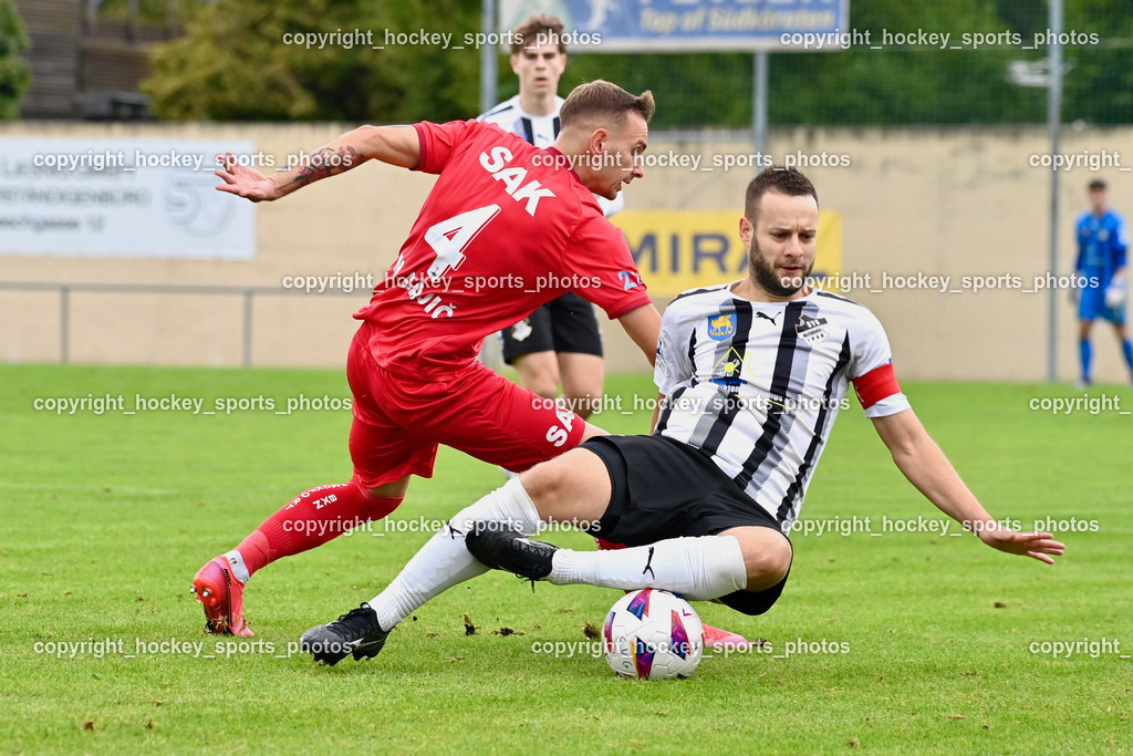 SVG Bleiburg vs. SAK 23.9.2023 | #4 Marko Gajic SAK, #9 Adnan Besic (K) SVG Bleiburg, SVG Bleiburg vs. SAK 23.9.2023, SVG Bleiburg vs. SAK am 23.09.2023 in Bleiburg (Karl Kornberger Stadion), Austria, (Photo by Bernd Stefan)