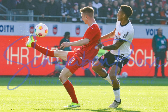 240224Ho654 | Jan Schoeppner (FC Heidenheim), Tuta (Eintracht Frankfurt) - FC Heidenheim - Eintracht Frankfurt
Fussball Bundesliga, Saison 2023_24, 24. Spieltag, FC Heidenheim-Eintracht Frankfurt 
Deutschland, Heidenheim, Voith Arena, 02.03.2024

(DFL DFB REGULATIONS PROHIBIT ANY USE OF PHOTOGRAPHS as IAMGE SEQUENCES and or QUASI-VIDEO).

