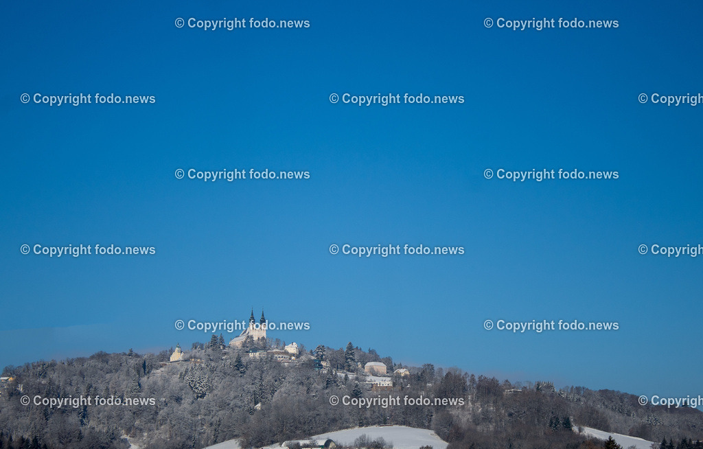 Poestlingberg_ Wallfahrtsbasilika_ 11.01.2026-1 | 11.01.2026, LINZ, AUT, Poestlingbergkirche, Wallfahrtsbasilika, Wahrzeichen, Linz, im Bild Poestlingberg, Kirche, Berg, Schnee, Winter, Wintersonne, Sonne, Himmel, Turm, Tuerme, Ausflugsziel, Gebaeude