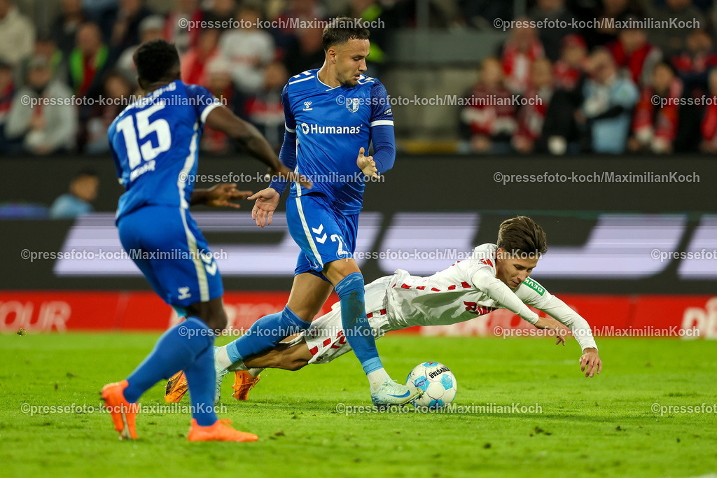 Koe14092401046 | 14.09.2024, 2. Fußball Bundesliga, 1. FC Köln - 1. FC Magdeburg, RheinEnergieSTADION, Saison 2024 2025: Zweikampf im Strafraum Falko Michel (1.FC Magdeburg #21) bringt Denis Huseinbasic (1.FC Köln #8) zu Fall - kein FoulDFB regulations prohibit any use of photographs as image sequences and or quasi-video.
