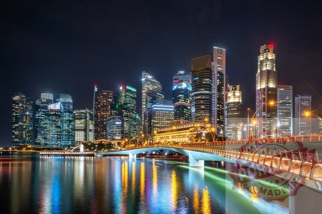 Singapore city skyline at night reflecting in marina bay | Singapore city skyline featuring skyscrapers and bridge lights reflecting in water at night - Realized with Pictrs.com