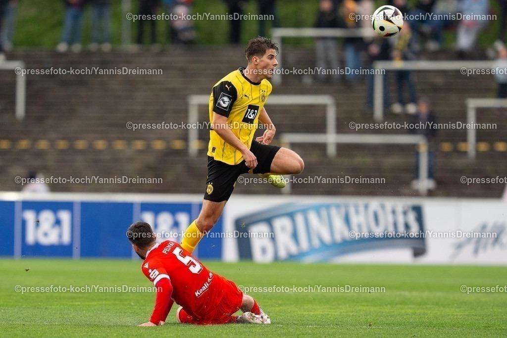 xydr13042501040 | 13.04.2025, xydrx, Fußball, Borussia Dortmund II - FC Energie Cottbus, 3.Liga, Stadion Rote Erde, Saison 2024 2025: Dominik Pelvian (FC Energie Cottbus #5) im Zweikampf gegen Franz Roggow (Borussia Dortmund II #8) DFB regulations prohibit any use of photographs as image sequences and or quasi-video.