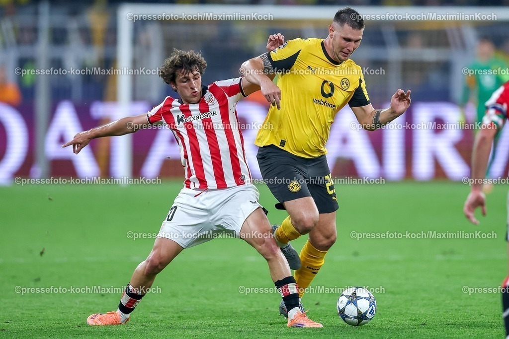 UCL01102501207 | 01.10.2025, Fußball, UEFA Champions League, Borussia Dortmund - Athletic Club Bilbao, BVB Stadion, 2. Spieltag, Saison 2025 2026: Unai Gomez (Bilbao #20) im Zweikampf gegen  Niklas Süle (BVB #25)  Regulations prohibit any use of photographs as image sequences and or quasi-video.