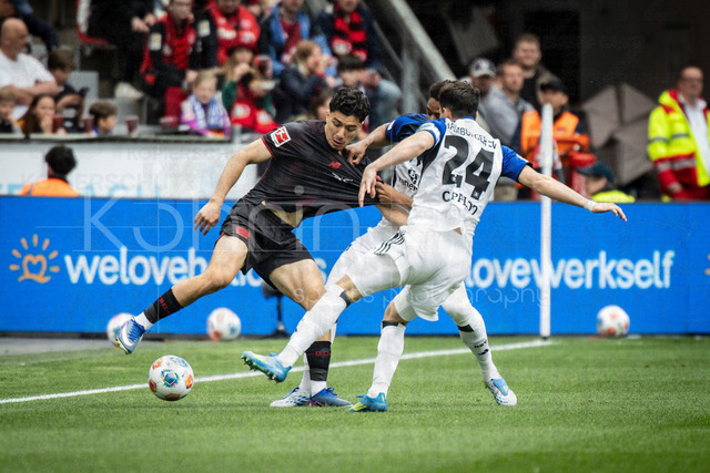 German Bundesliga, Bayer 04 Leverkusen vs. Hamburger SV, 16.05.2026 | LEVERKUSEN, GERMANY - MAY 16, 2026 :  Ibrahim Maza (Bayer 04 Leverkusen, 30) tackled by Warmed Omari (Hamburger SV, 17) and Nicolas Capaldo (Hamburger SV, 24) during the German Bundesliga match on gameday 34 between Bayer 04 Leverkusen vs. Hamburger SV at BayArena on May 16, 2026 in Leverkusen, Germany. DFL REGULATIONS PROHIBIT ANY USE OF PHOTOGRAPHS AS IMAGE SEQUENCES AND/OR QUASI-VIDEO.