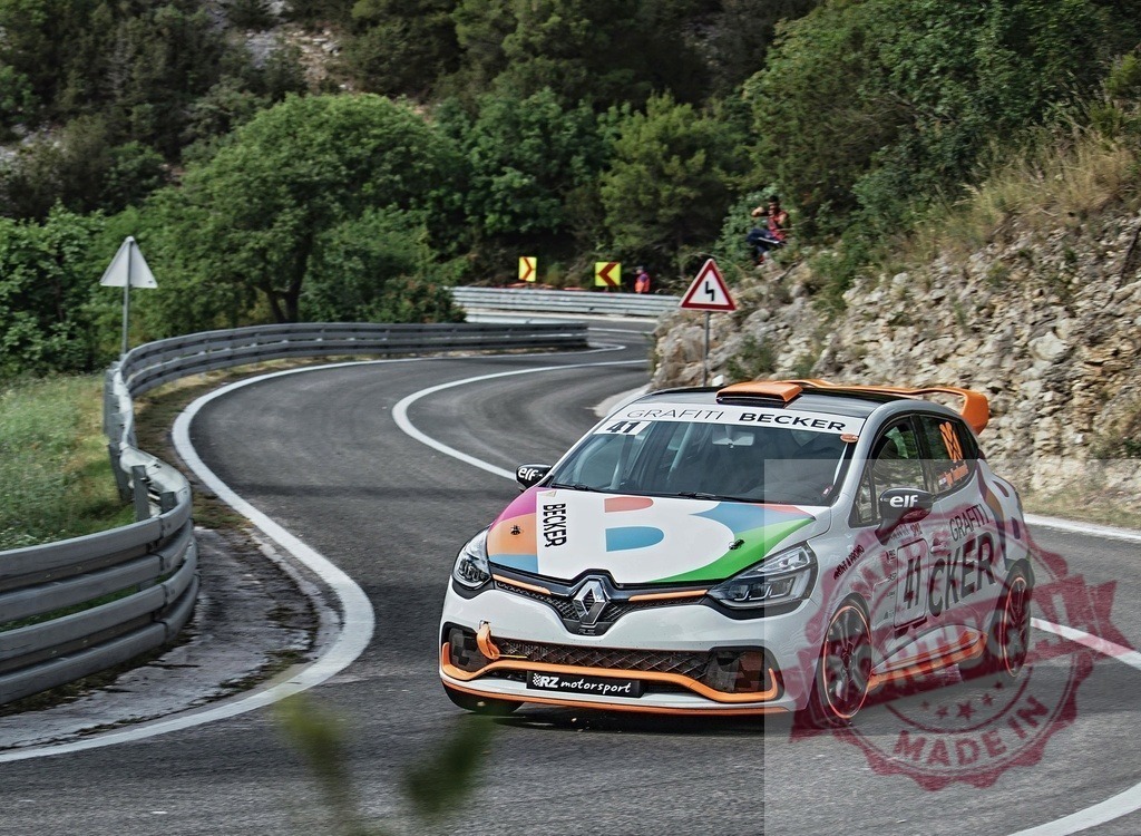 Renault Clio rally car racing on winding mountain road Becker | Rally car navigating a sharp curve on a challenging mountain road race - Realisiert mit Pictrs.com