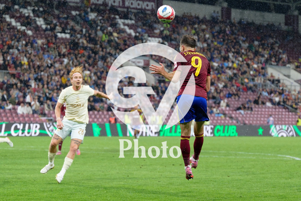 UEFA Conference League Play-offs 2nd leg - Servette FC v FC Shakhtar Donetsk | Miroslav Stevanovic (9 Servette FC) jumps for a header Yukhym Konoplia (26 FC Shakhtar Donetsk) is looking during the UEFA Conference League Play-offs 2nd leg match between Servette FC and FC Shakhtar Donetsk at Stade de Geneve in Geneva, Switzerland