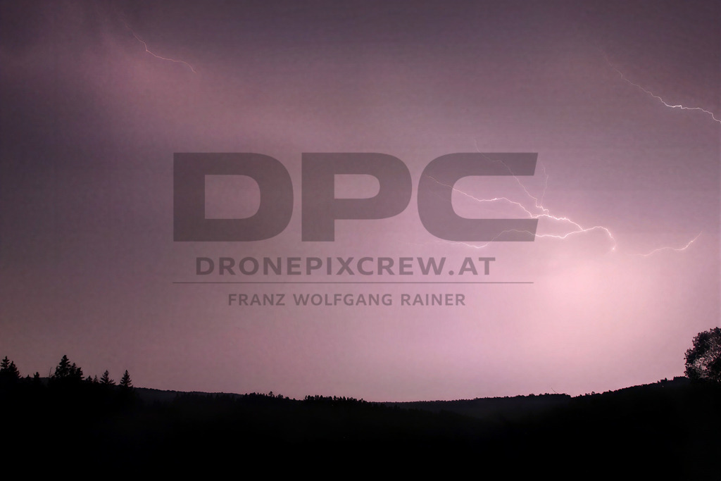 Lightning Storm over the Almenland | Multiple lightning strikes illuminate the night sky over the Almenland region in Austria during a powerful summer thunderstorm. - Realisiert mit Pictrs.com