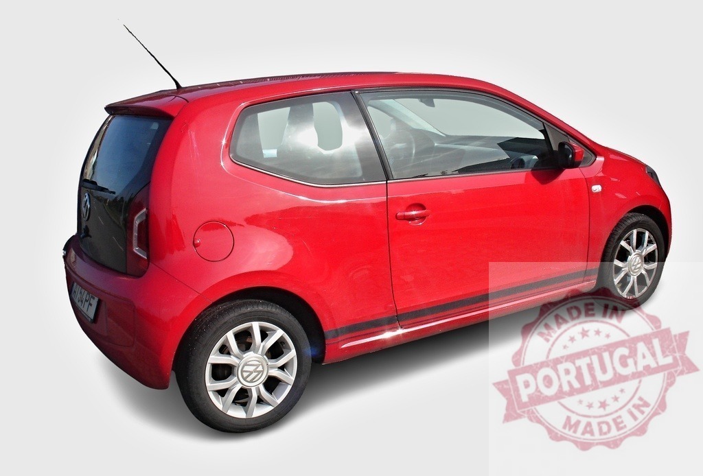 Red Volkswagen Up! city car parked on white background | Shiny red Volkswagen Up! city car parked on a white background, showcasing its compact design and modern features - Realized with Pictrs.com