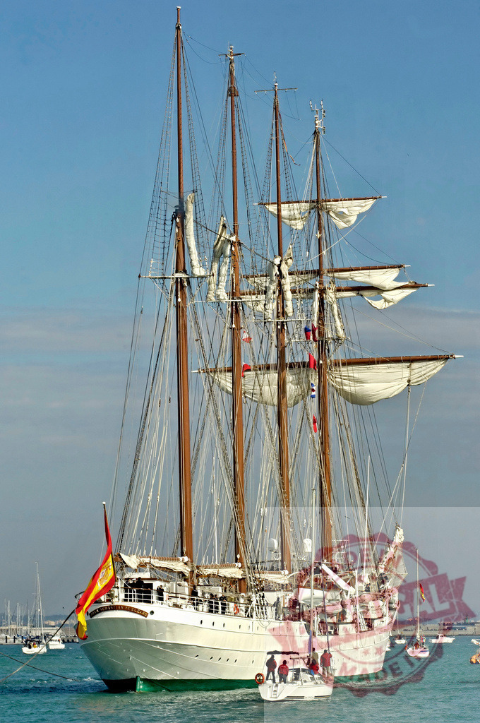 Juan Sebastian Elcano Spanish Navy training ship sailing. Espana - Cadiz | Juan Sebastian Elcano, a Spanish Navy training ship, sailing on blue waters - Realized with Pictrs.com
