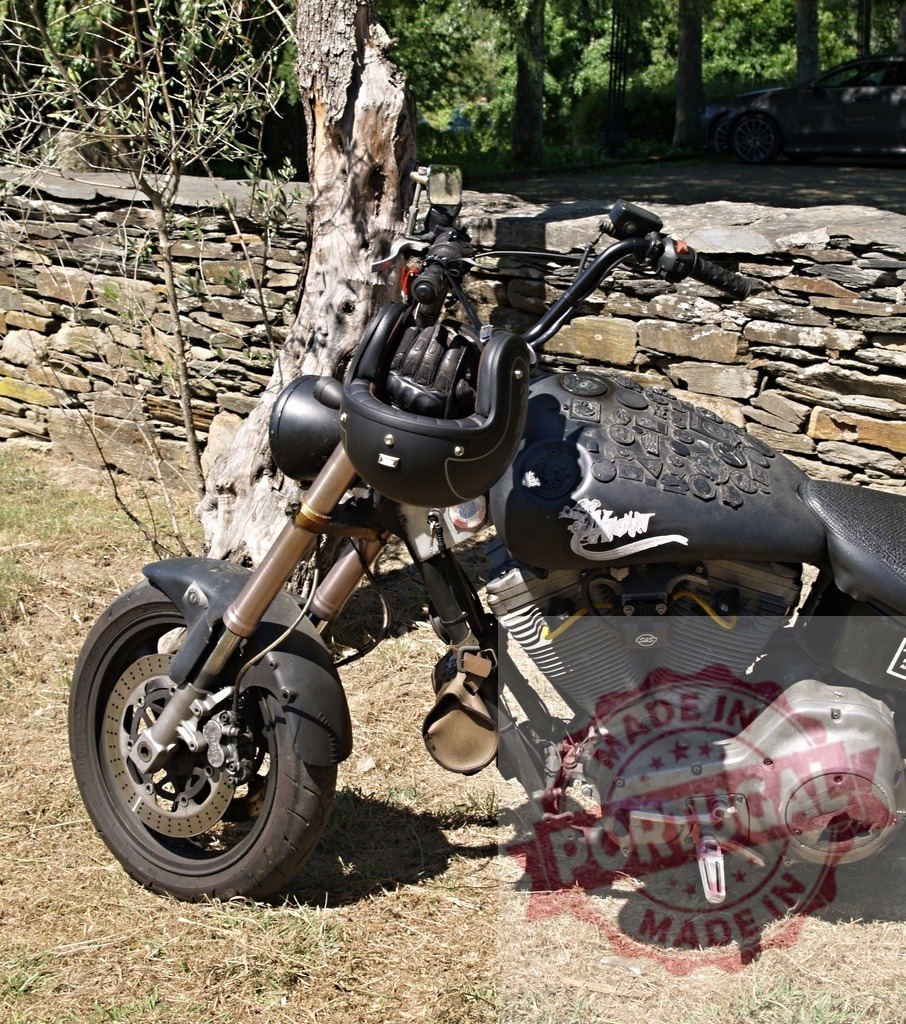 Customized motorcycle parked near stone wall with helmet and gloves | Powerful custom chopper motorcycle parked near a stone wall, displaying a helmet and gloves, suggesting a biker's recent stop - Realisiert mit Pictrs.com