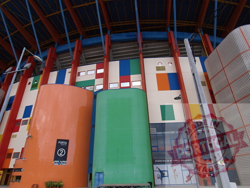Estádio Dr. Magalhães Pessoa modern colorful exterior architecture | Estádio Dr. Magalhães Pessoa exterior showcasing its vibrant, contemporary design with multiple colors - Realized with Pictrs.com