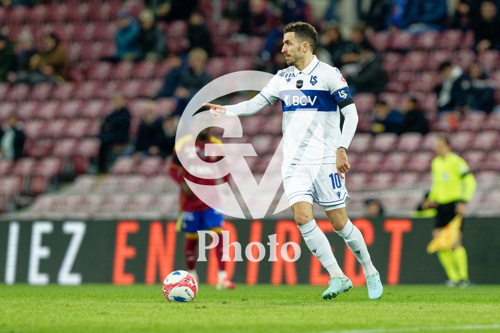 Brack Super League - Servette FC v FC Lausanne-Sport | Olivier Custodio (10 FC Lausanne-Sport) controls the ball (action)  during the Brack Super League match between Servette FC and FC Lausanne-Sport at Stade de Geneve in Geneva, Switzerland