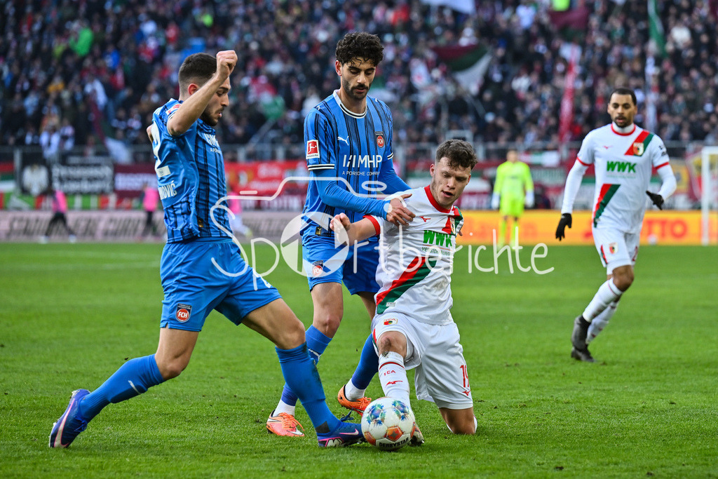 FC Augsburg - 1. FC Heidenheim | AUGSBURG, GERMANY - 15. FEBRUARY: v. l. Arijon IBRAHIMOVIC (1. FC Heidenheim 22), Julian NIEHUES (1. FC Heidenheim 16) und Robin FELLHAUER (FC Augsburg 19) während dem Bundesligamatch zwischen dem FC Augsburg und dem 1. FC Heidenheim am 22. Spieltag in der WWK-Arena / DFL REGULATIONS PROHIBIT ANY USE OF PHOTOGRAPHS AS IMAGE SEQUENCES AND/OR QUASI-VIDEO