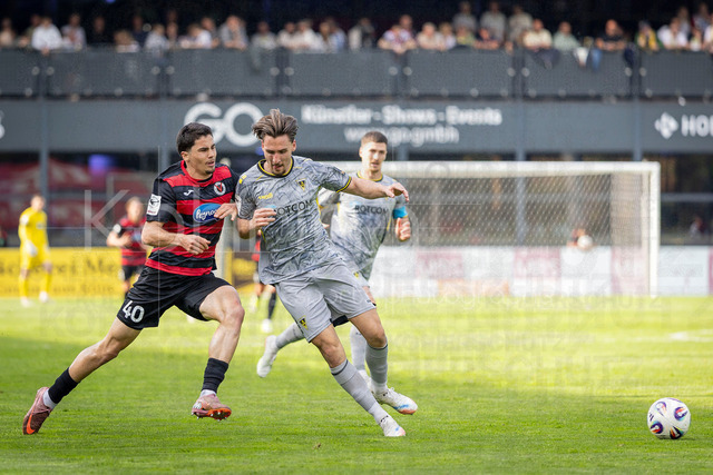 German 3rd Division, Viktoria Koeln vs. Alemannia Aachen, 10.05.2026 | KOELN, GERMANY - MAY 10, 2026: Jakob Sachse (Viktoria Köln, 40) is challenged by Petros Bagkalianis (Alemannia Aachen, 2) during the 3rd division match on gameday 37 between Viktoria Koeln vs. Alemannia Aachen at the Sportpark Hoehenberg on May 10, 2026 in Koeln, Germany. DFL REGULATIONS PROHIBIT ANY USE OF PHOTOGRAPHS AS IMAGE SEQUENCES AND/OR QUASI-VIDEO.