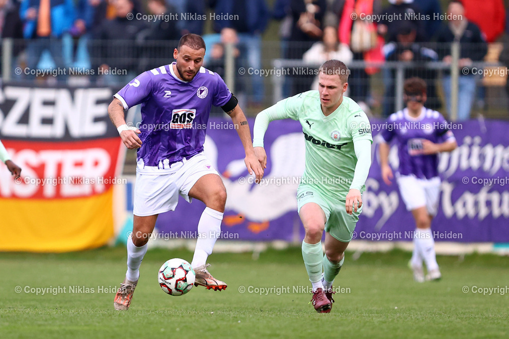 NH_VfRNeumuenster_PSVNeumuenster_FlensOberliga_15042026 | #19 Kastriot Alija (VfR Neumünster), #26 Paul Eberhardt (PSV Union Neumünster)Fußball I Herren I Flens Oberliga I Saison 2025-2026  I 19. Spieltag I VfR Neumünster - PSV Union Neumünster I 15.04.2026 I VfR Stadion HSP (Grümmi Arena)