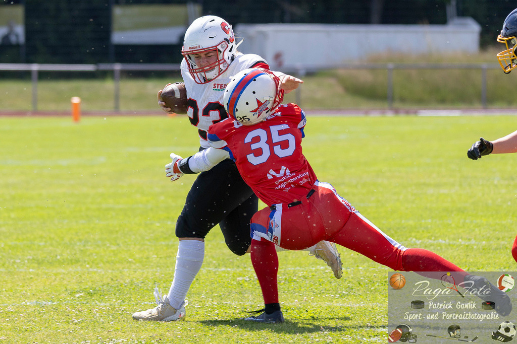 GFLW 1: German Football League Women 1: Rodgau Pioneers Ladies - Stuttgart Scorpions Sisters, 07.06.2026 | Annalena Welter (Stuttgart Scorpions Sisters #23) mit dem Stiffarm gegen,  Jennifer Gerndt (Rodgau Pioneers Ladies #35) Rodgau Pioneers Ladies - Stuttgart Scorpions Sisters, Rodgau, Maingau-Energie-Stadion "Am Weichsee", 7.6.2026 - Realisiert mit Pictrs.com