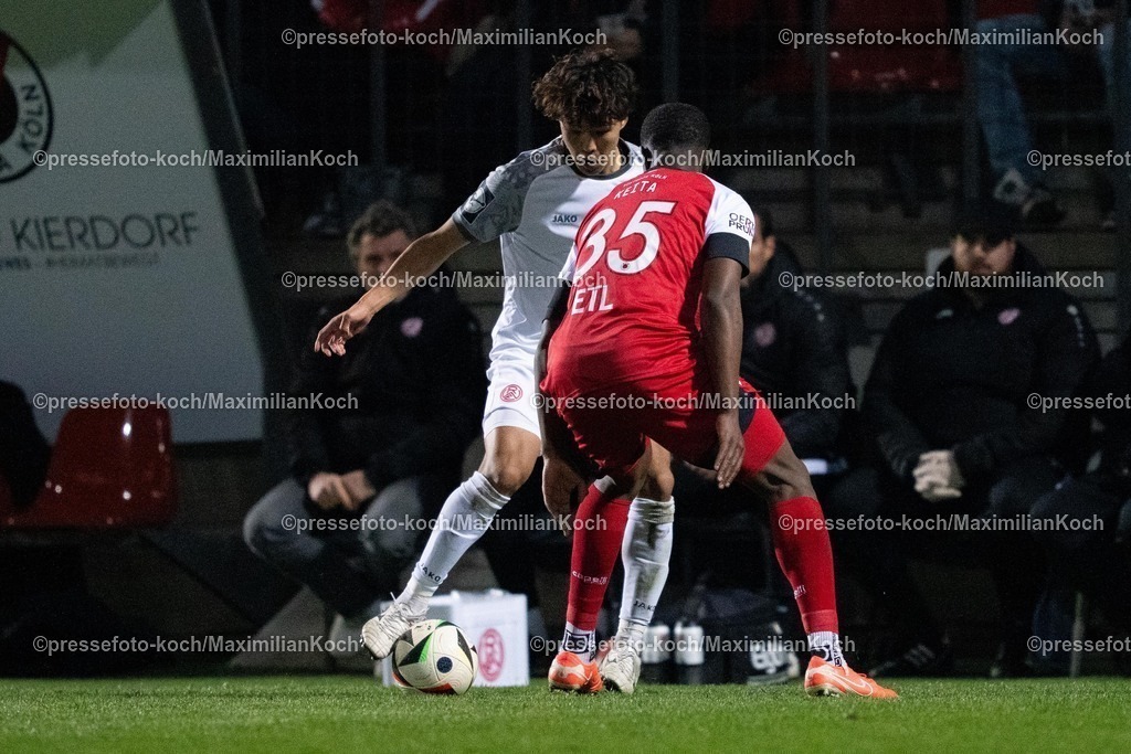xYDR12032501110 | 12.03.2025, xydrx, Fußball, Viktoria Köln - Rot-Weiss Essen, 3.Liga, Sportpark Höhenberg, Saison 2024 2025: Zoumana Keita (Viktoria Köln #35) im Zweikampf gegen Kaito Mizuta (Rot-Weiss Essen #24). DFB regulations prohibit any use of photographs as image sequences and or quasi-video.