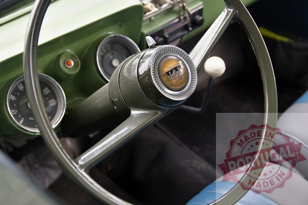 Vintage car interior showing green dashboard and steering wheel | Close-up view of an oldtimer vehicle's classic dashboard, steering wheel, and gauges - Realized with Pictrs.com