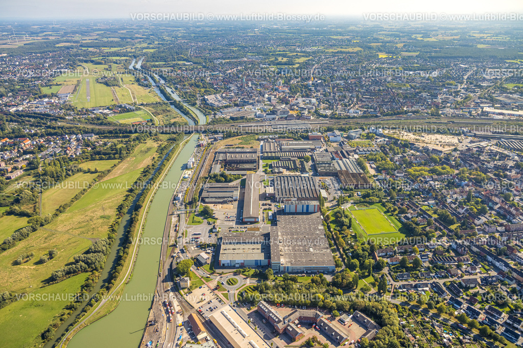 Hamm250901699 | Luftbild, Hafen am Datteln-Hamm-Kanal, Gewerbegebiet Hafenstraße und Dortmunder Straße, voestalpin Böhler Werk, Blick zum Flugplatz und der City mit Hbf Hauptbahnhof, Mitte, Hamm, Ruhrgebiet, Nordrhein-Westfalen, Deutschland