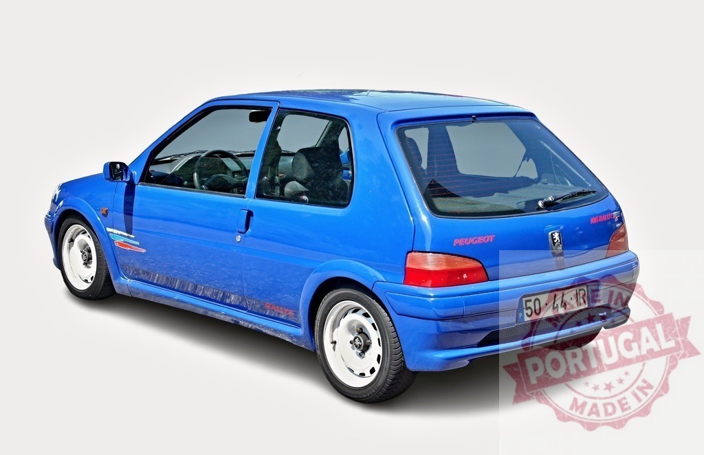 Blue Peugeot 106 Rallye standing still on a white background | Rear view of a blue Peugeot 106 Rallye from the nineties standing still on a white background - Realized with Pictrs.com