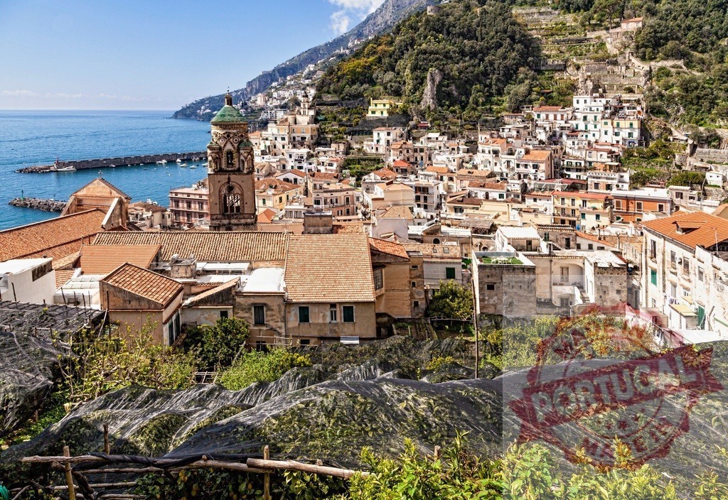 Amalfi town on Italy's Amalfi Coast with bell tower | Amalfi town built on cliffs overlooking the Mediterranean Sea, with a prominent bell tower and port - Realized with Pictrs.com
