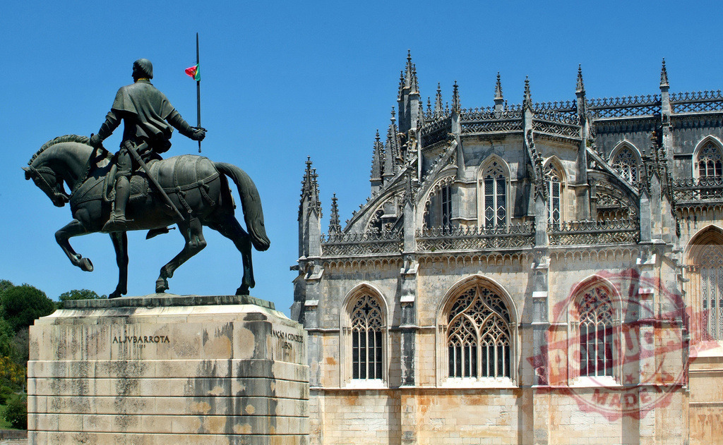Nuno Álvares Pereira equestrian statue and Batalha Monastery | Nuno Álvares Pereira equestrian statue standing in front of gothic Batalha Monastery - Realized with Pictrs.com